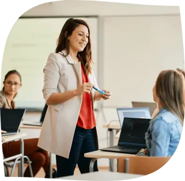 Teacher guiding a classroom presentation